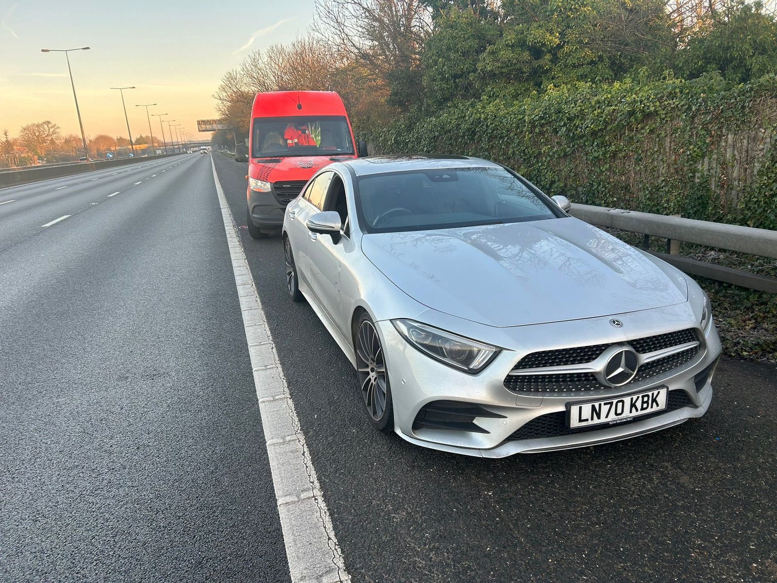 White Mercedes broken down at the roadside