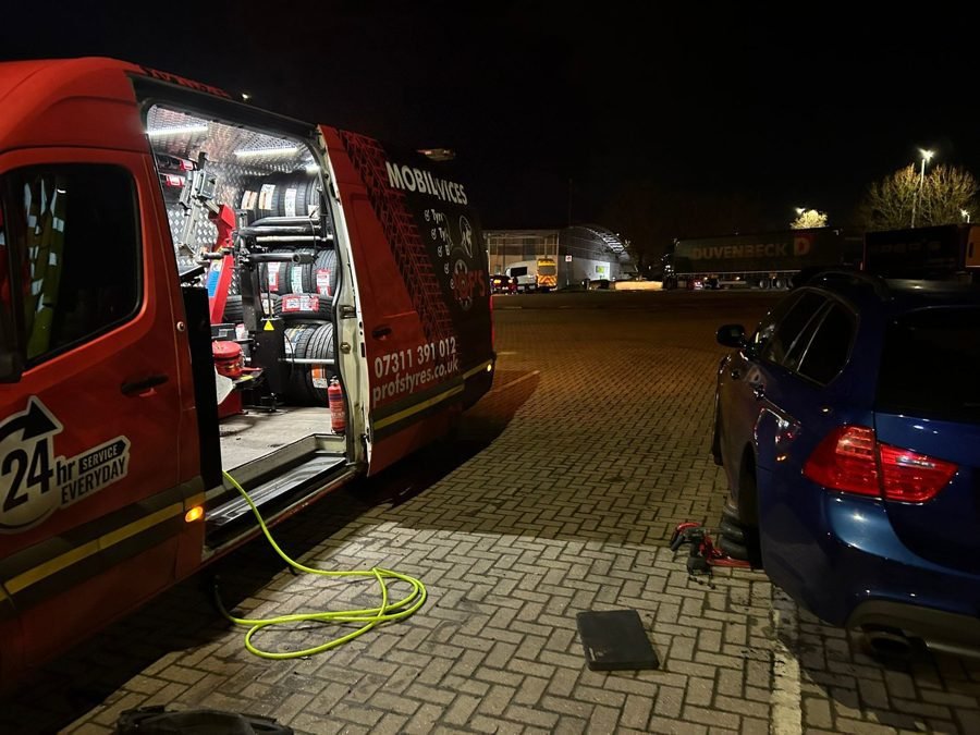 Prof's van at night with its equipment bay lit and open